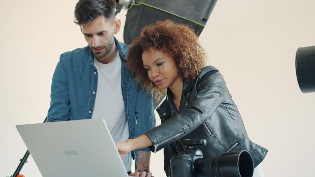 Team of photographers reviewing photographs together in a studio
