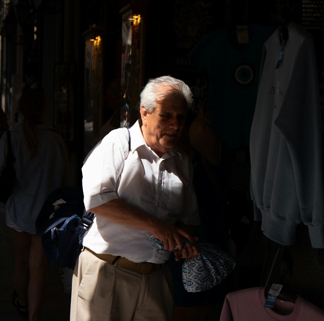 Elderly Chilean vendor selling produce at a local street market